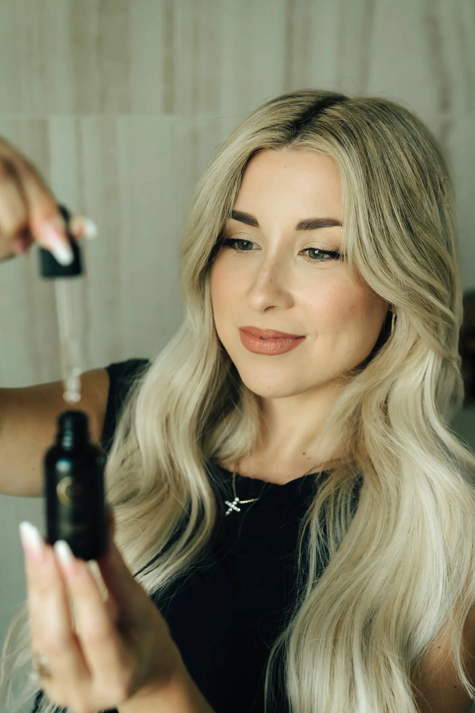 Woman applying CFC treatment serum